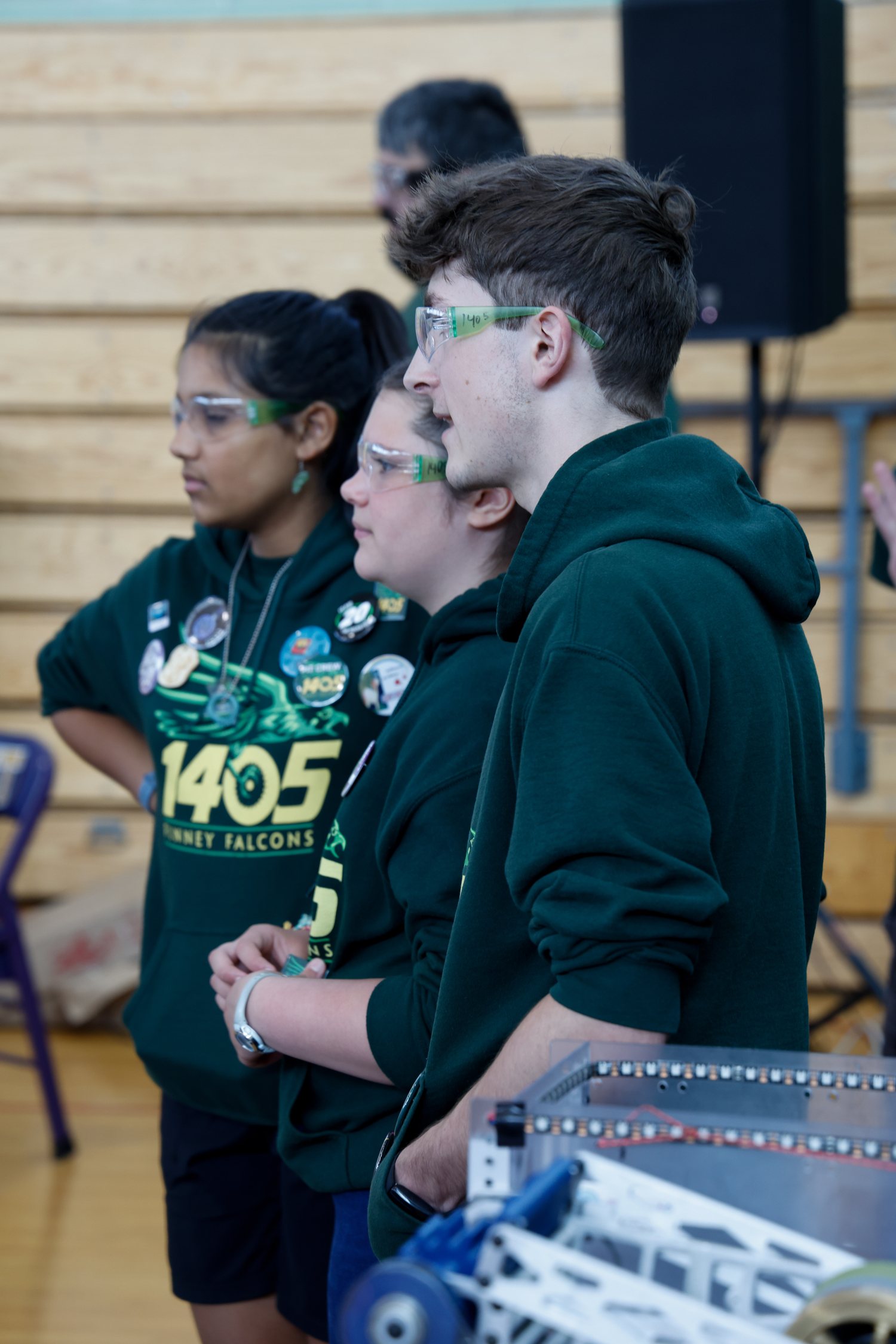 Team 1405's drive team watching a match from the field